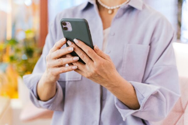 Woman Playing Sudoku Online on her phone