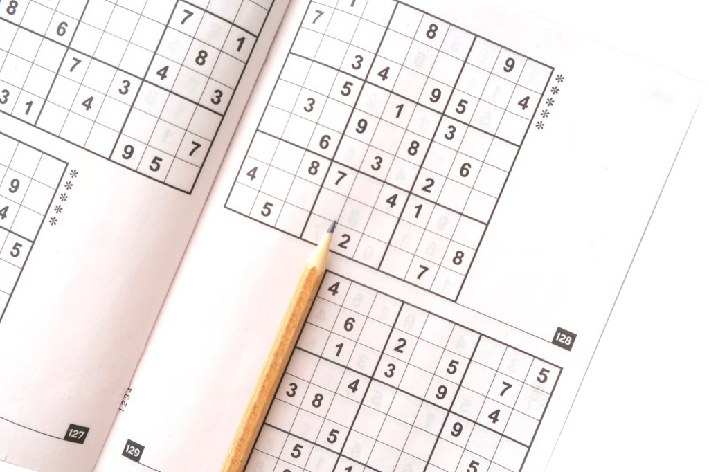 Open Sudoku Book with pencil